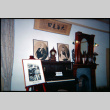 Display of photos, piano and fireplace surround (ddr-densho-426-476)