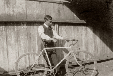 Yoshio Itahara with bicycle (ddr-ajah-6-507)