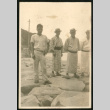Men on rocky beach (ddr-densho-359-780)