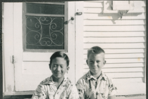 Two boys sitting in steps (ddr-densho-523-292)
