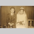 Bride and groom seated, posing in Western clothes (ddr-njpa-4-21)