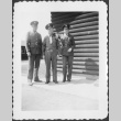 Three men standing outside building (ddr-densho-434-389)