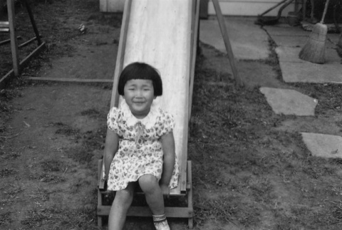 Young girl on slide (ddr-ajah-6-35)