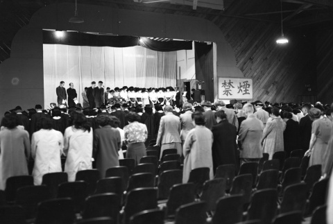 Ceremony in an auditorium at Minidoka (ddr-fom-1-442)