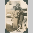 Two women next to car (ddr-densho-316-359)