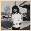 Girl holding flower (ddr-densho-522-128)