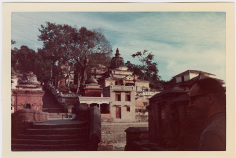 Shrine with stairs, man in foreground (ddr-densho-426-1135)