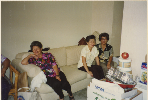 Three women sitting on a couch (ddr-densho-466-475)