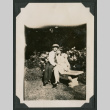 man and woman sitting on garden bench (ddr-densho-378-493)