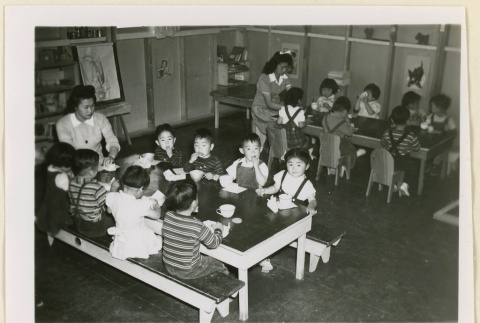 Children eating at tables (ddr-densho-37-1064)