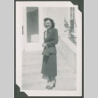 A woman standing on front steps (ddr-densho-328-236)