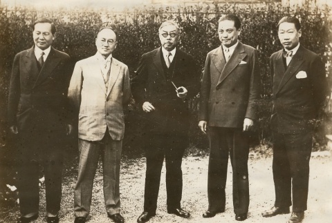 Yan Huiqing with group of men posing for a photograph (ddr-njpa-1-434)
