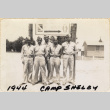 Group of five men standing by sign (ddr-densho-466-342)