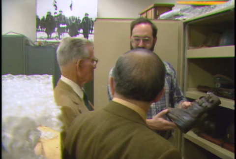 Eric Saul gives John Burden and Shig Kihara a tour of the Presidio Army Museum (ddr-densho-1007-1786)