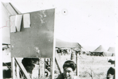 Soldier with gun on tripod (ddr-densho-1007-781)