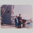 Agnes Sakura and  Gerald Sakura standing next to navy ship (ddr-densho-523-371)