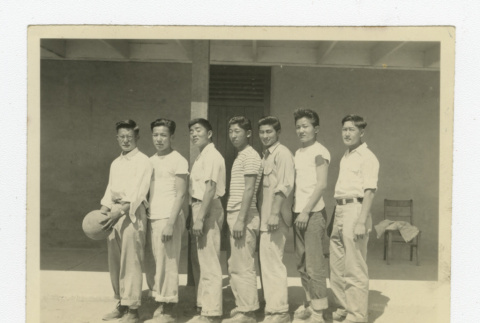 Nisei basketball team in front of barrack (ddr-csujad-44-40)