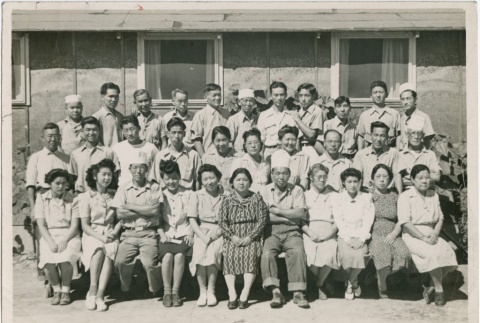 Mess hall staff posing for a group photo (ddr-densho-292-3)