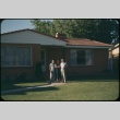 Three people in front of a house (ddr-densho-338-507)