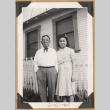 Man and young woman by a picket fence (ddr-densho-542-213)