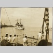 Sailors on another ship watching the USS Astoria entering a harbor (ddr-njpa-13-351)