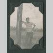 Man leaning against a pole (ddr-densho-471-69)