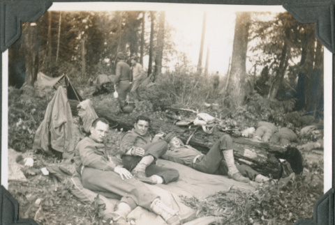 Three men lying in forest (ddr-ajah-2-251)