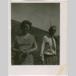 Man and woman by building (ddr-densho-329-738)