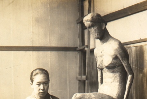 Sculptor posing with a statue (ddr-njpa-4-1909)