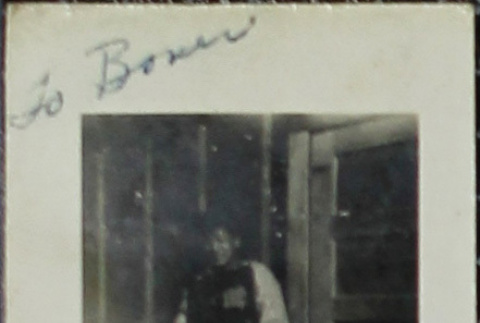A young man in front of barracks (ddr-densho-321-1149)