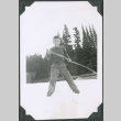Photo of Paul Ima on a glacier with a stick (ddr-densho-483-1325)
