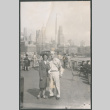Agnes and Chester Sakura with New York skyline (ddr-densho-523-161)