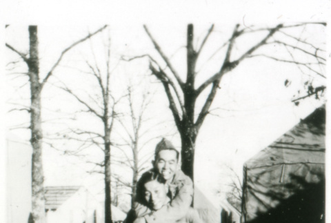 Two soldiers, piggyback ride (ddr-densho-1007-605)