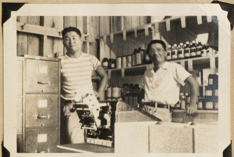 Mabo and Frank Eya at the warehouse (ddr-densho-542-541)