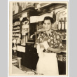 Man working behind a counter (ddr-densho-542-802)