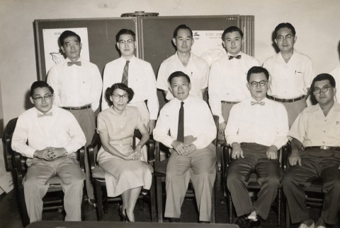 Group of men and one woman posing for a photograph (ddr-njpa-2-592)