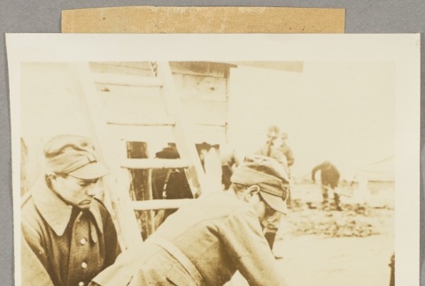 Two soldiers sawing a piece of wood (ddr-njpa-13-1070)
