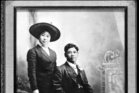 Pair at photo studio (ddr-densho-1007-46)