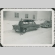 Man with argyle socks standing near a car (ddr-densho-321-346)