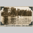 Three men in rowboat on lake (ddr-densho-383-181)