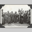 Group of soldiers playing instruments on ship's deck (ddr-densho-466-152)