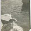 George Nakano resting on a lifeboat (ddr-densho-296-189)