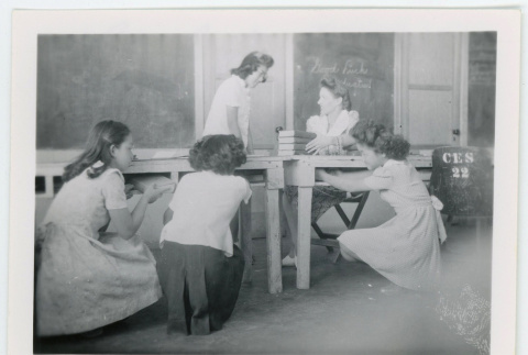Students cleaning out desks (ddr-densho-37-2133)