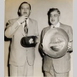 Urban E. Wild and another man holding bowls (ddr-njpa-2-1062)