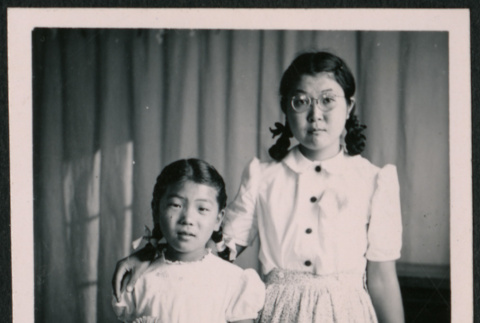 Young Japanese American woman and girl with pigtails (ddr-densho-362-35)