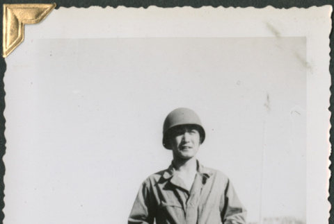 Man standing in field (ddr-densho-434-325)