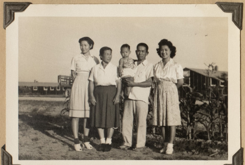 The Kikawas beside a garden (ddr-densho-542-514)