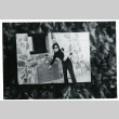 [Woman with Manzanar plaque] (ddr-csujad-29-154)