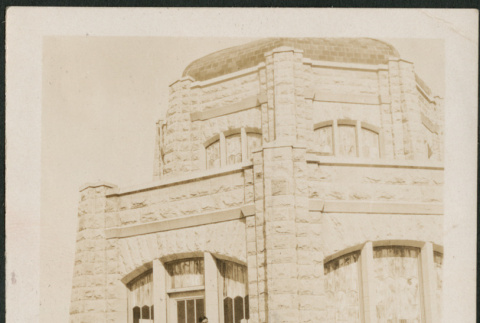 Man on steps of stone building (ddr-densho-316-275)