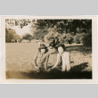 Tomoye (Nozawa) Takahashi and unidentified woman sitting in park (ddr-densho-426-2103)